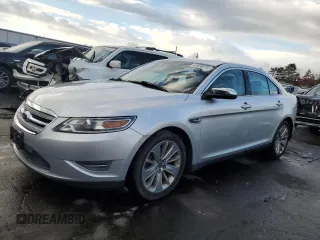 2010 Ford Taurus Limited z VIN 1FAHP2JW1AG103875, wystawiony jako Copart lot #83698394 z przebiegiem 148 013 mil mil oraz Czysty tytuł • Clean title. Historia ofert i sprzedaży dostępna na DreamBid. Obrazek 1.