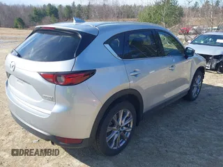 2021 Mazda CX-5 Grand Touring Reserve with VIN JM3KFBAY5M0472988, listed as a IAAI auction lot 41897855 with 27,318 mi miles. Bid and sale history available at carsss.com. Image 4.