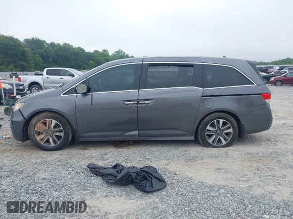 2014 Honda Odyssey Touring with VIN 5FNRL5H98EB008953, listed as a IAAI auction lot 42291179 with Not provided miles and . Bid and sale history available at DreamBid. Image 13.