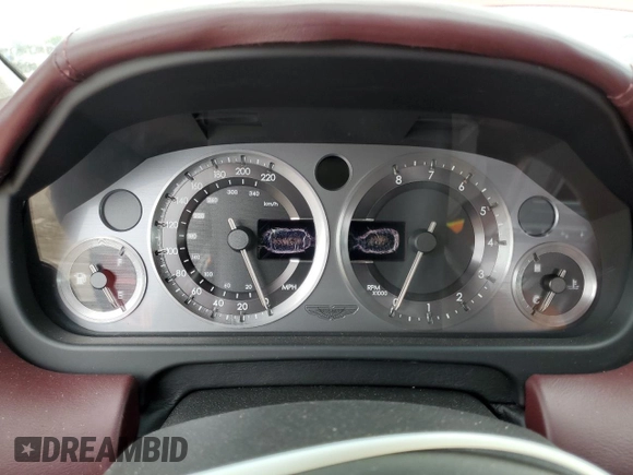 2005 Aston Martin DB9 z VIN SCFAD01A15GA00012, wystawiony jako Copart lot #65919164 z przebiegiem Nie podano mil oraz Szkody całkowita. Historia ofert i sprzedaży dostępna na DreamBid. Obrazek 9.