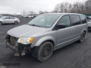 2014 Dodge Grand Caravan SE with VIN 2C4RDGBGXER106984, listed as a IAAI auction lot 41815414 with 170,984 mi miles. Bid and sale history available at carsss.com. Image 2.