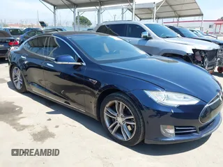 2013 Tesla Model S with VIN 5YJSA1DN1DFP05317, listed as a IAAI auction lot 42086998 with 150,964 mi miles. Bid and sale history available at carsss.com. Image 1.