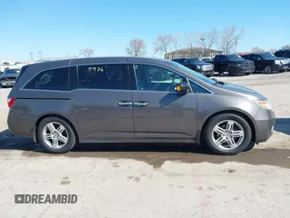 2012 Honda Odyssey Touring with VIN 5FNRL5H9XCB077351, listed as a IAAI auction lot 42045976 with 146,290 mi miles and . Bid and sale history available at DreamBid. Image 13.