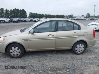 2006 Hyundai Accent GLS z VIN KMHCN46C66U058232, wystawiony jako IAAI lot #41899629 z przebiegiem 182 669 mil mil oraz . Historia ofert i sprzedaży dostępna na DreamBid. Obrazek 14.