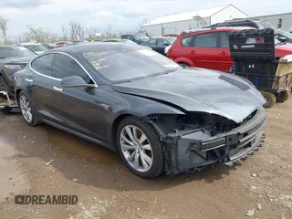 2015 Tesla Model S 85D with VIN 5YJSA1E21FF116775, listed as a IAAI auction lot 41876772 with 128,805 mi miles. Bid and sale history available at carsss.com. Image 1.