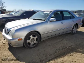 2000 Mercedes-Benz E-Class with VIN WDBJF70J8YB107221, listed as a Copart auction lot 45710185 with 210,939 mi miles and Clean Title. Bid and sale history available at carsss.com. Image 1.
