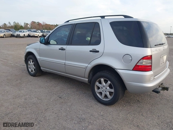 1999 Mercedes-Benz M-Class with VIN 4JGAB72EXXA131890, listed as a IAAI auction lot 41721001 with 168,969 mi miles. Bid and sale history available at carsss.com. Image 3.