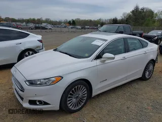 2013 Ford Fusion Titanium Hybrid with VIN 3FA6P0RU5DR357469, listed as a IAAI auction lot 41969315 with 215,732 mi miles. Bid and sale history available at carsss.com. Image 2.