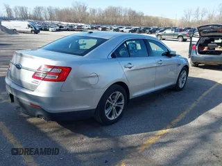 2013 Ford Taurus SEL with VIN 1FAHP2E8XDG191132, listed as a IAAI auction lot 41833542 with 165,125 mi miles. Bid and sale history available at carsss.com. Image 4.