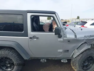 2013 Jeep Wrangler Rubicon 10th Anniversary with VIN 1C4BJWCG8DL639121, listed as a IAAI auction lot 40561773 with 56,023 mi miles and . Bid and sale history available at DreamBid. Image 13.