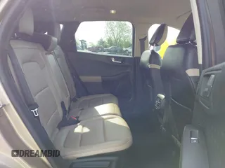 2020 Ford Escape Titanium z VIN 1FMCU9J92LUB48243, wystawiony jako IAAI lot #42143038 z przebiegiem 63 172 mil mil oraz . Historia ofert i sprzedaży dostępna na DreamBid. Obrazek 8.