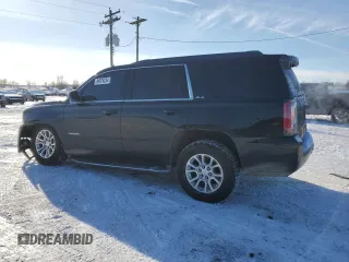 2015 GMC Yukon SLE with VIN 1GKS2AKC0FR267745, listed as a Copart auction lot 84876234 with 145,716 mi miles and Clean Title. Bid and sale history available at carsss.com. Image 2.