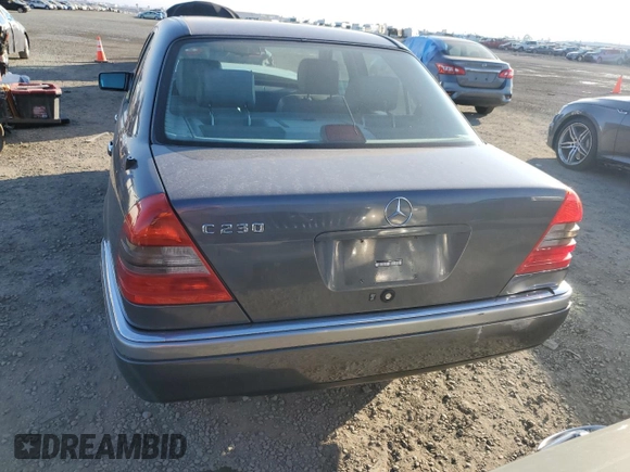 1997 Mercedes-Benz C with VIN WDBHA23E7VF545229, listed as a Copart auction lot 43518335 with 153,158 mi miles and Salvage title. Bid and sale history available at DreamBid. Image 6.