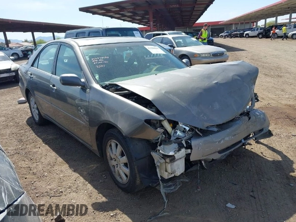 2004 Toyota Camry LE with VIN 4T1BF30K24U569209, listed as a IAAI auction lot 41988665 with 191,017 mi miles. Bid and sale history available at carsss.com. Image 1.