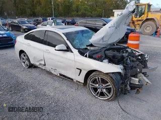 2015 BMW 4 Series 428i xDrive with VIN WBA4C9C57FD330866, listed as a IAAI auction lot 40574326 with 123,726 mi miles and . Bid and sale history available at DreamBid. Image 1.