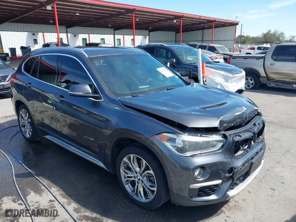 2017 BMW X1 xDrive28i with VIN WBXHT3Z33H4A65198, listed as a IAAI auction lot 41798503 with 88,951 mi miles. Bid and sale history available at carsss.com. Image 1.
