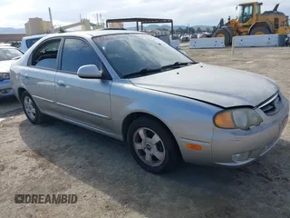 2003 Kia Spectra GS with VIN KNAFB161535095413, listed as a IAAI auction lot 41478418 with 141,441 mi miles. Bid and sale history available at carsss.com. Image 1.