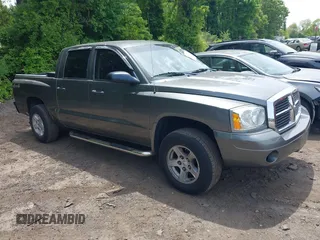 2006 Dodge Dakota SLT z VIN 1D7HW48K76S603335, wystawiony jako IAAI lot #42347808 z przebiegiem 151 748 mil mil oraz . Historia ofert i sprzedaży dostępna na DreamBid. Obrazek 1.