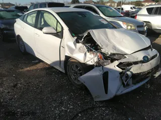 2022 Toyota Prius L Eco with VIN JTDKAMFU5N3156063, listed as a IAAI auction lot 41214358 with 208,666 mi miles. Bid and sale history available at carsss.com. Image 1.