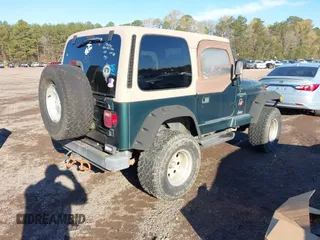 2000 Jeep Wrangler Sahara with VIN 1J4FA59S2YP734290, listed as a IAAI auction lot 41874866 with 201,036 mi miles. Bid and sale history available at carsss.com. Image 4.