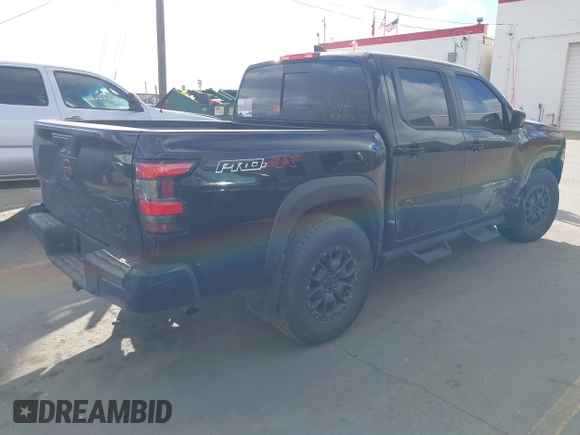 2023 Nissan Frontier SV with VIN 1N6ED1EK0PN658048, listed as a IAAI auction lot 41383407 with 13,744 mi miles and . Bid and sale history available at DreamBid. Image 4.