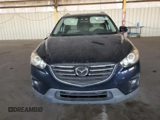 2016 Mazda CX-5 Touring with VIN JM3KE2CY7G0653854, listed as a Copart auction lot 74825564 with 139,193 mi miles and Salvage Title. Bid and sale history available at DreamBid. Image 5.