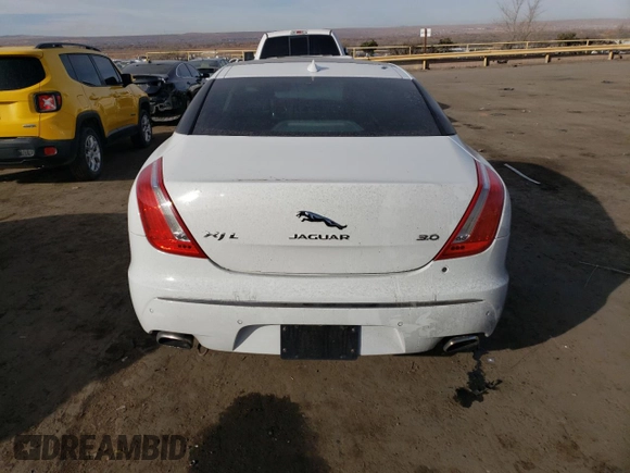 2014 Jaguar XJ with VIN SAJWA2GZ7E8V69543, listed as a Copart auction lot 86390204 with 110,929 mi miles and Salvage Title. Bid and sale history available at carsss.com. Image 6.