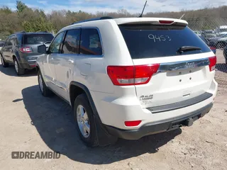 2011 Jeep Grand Cherokee Laredo with VIN 1J4RR4GG9BC556083, listed as a IAAI auction lot 42139453 with 145,623 mi miles and . Bid and sale history available at DreamBid. Image 3.