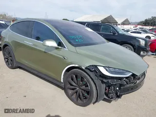 2018 Tesla Model X 75D with VIN 5YJXCBE23JF135990, listed as a IAAI auction lot 41686900 with 83,011 mi miles. Bid and sale history available at carsss.com. Image 1.