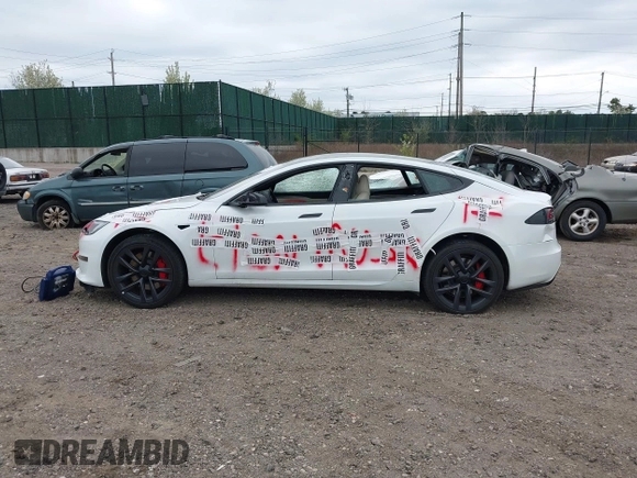 2023 Tesla Model S Plaid with VIN 5YJSA1E68PF507197, listed as a IAAI auction lot 42062258 with Not provided miles and . Bid and sale history available at DreamBid. Image 14.
