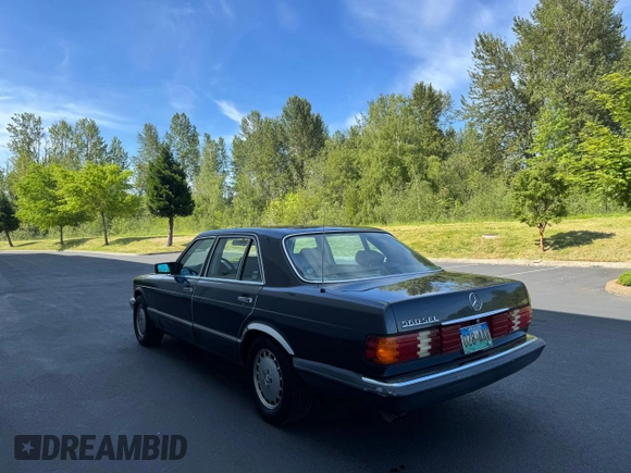 1986 Mercedes-Benz 560 with VIN WDBCA39D0GA203068, listed as a Copart auction lot 56704555 with 107,817 mi miles and Clean Title. Bid and sale history available at DreamBid. Image 3.