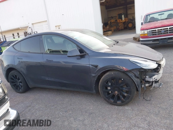 2023 Tesla Model Y Long Range with VIN 7SAYGDEE1PA053683, listed as a IAAI auction lot 42124517 with 32,295 mi miles. Bid and sale history available at carsss.com. Image 12.