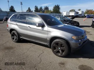 2005 BMW X5 4.4i with VIN 5UXFB53575LV16692, listed as a Copart auction lot 77866544 with 153,963 mi miles and Clean Title. Bid and sale history available at carsss.com. Image 4.