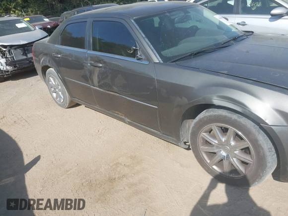 2009 Chrysler 300 Touring with VIN 2C3LA53V09H520923, listed as a IAAI auction lot 40408803 with 216,747 mi miles. Bid and sale history available at carsss.com. Image 6.