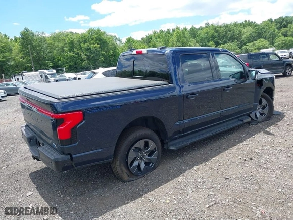 2023 Ford F-150 Lightning Pro with VIN 1FT6W1EVXPWG42428, listed as a IAAI auction lot 39711091 with 6,308 mi miles. Bid and sale history available at carsss.com. Image 4.