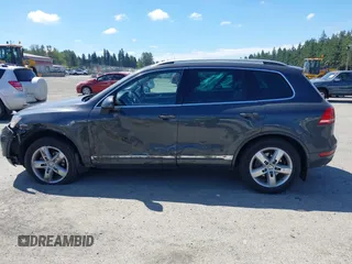 2012 Volkswagen Touareg Sport with VIN WVGFK9BP0CD004951, listed as a IAAI auction lot 42724125 with 173,993 mi miles and . Bid and sale history available at DreamBid. Image 14.