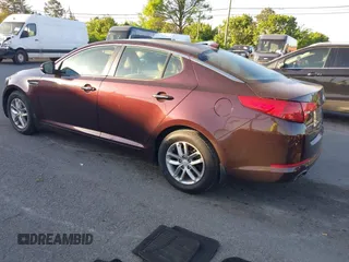 2013 Kia Optima LX with VIN 5XXGM4A71DG124725, listed as a IAAI auction lot 42041768 with 184,181 mi miles and . Bid and sale history available at carsss.com. Image 3.