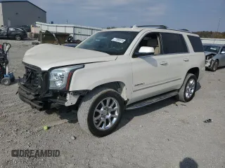 2015 GMC Yukon Denali z VIN 1GKS2CKJ6FR585220, wystawiony jako Copart lot #77395514 z przebiegiem 143 501 mil mil oraz Nie do naprawy • Non repairable. Historia ofert i sprzedaży dostępna na DreamBid. Obrazek 1.