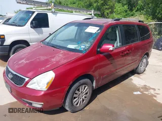 2014 Kia Sedona LX with VIN KNDMG4C71E6564595, listed as a IAAI auction lot 42015687 with 208,270 mi miles. Bid and sale history available at carsss.com. Image 2.