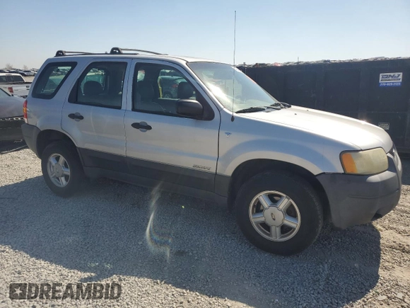 2002 Ford Escape XLS Choice with VIN 1FMYU02112KB00947, listed as a Copart auction lot 48948855 with 223,287 mi miles and Salvage title. Bid and sale history available at DreamBid. Image 4.