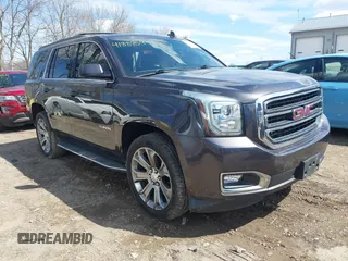 2015 GMC Yukon SLT z VIN 1GKS2BKCXFR606971, wystawiony jako IAAI lot #41889591 z przebiegiem 143 332 mil mil oraz . Historia ofert i sprzedaży dostępna na DreamBid. Obrazek 1.
