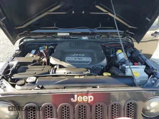 2014 Jeep Wrangler Unlimited Sport with VIN 1C4BJWDG1EL308834, listed as a Copart auction lot 53710065 with 127,612 mi miles and Clean Title. Bid and sale history available at DreamBid. Image 12.