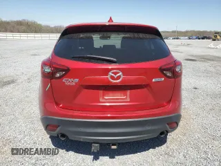 2016 Mazda CX-5 Grand Touring z VIN JM3KE2DYXG0840777, wystawiony jako Copart lot #49700585 z przebiegiem 116 469 mil mil oraz Szkoda całkowita • Salvage title. Historia ofert i sprzedaży dostępna na DreamBid. Obrazek 6.