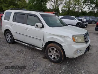 2011 Honda Pilot Touring z VIN 5FNYF4H9XBB053966, wystawiony jako IAAI lot #42148528 z przebiegiem 191 939 mil mil oraz . Historia ofert i sprzedaży dostępna na DreamBid. Obrazek 1.