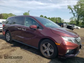 2018 Honda Odyssey EX with VIN 5FNRL6H55JB037386, listed as a Copart auction lot 63577475 with 125,498 mi miles and Salvage title. Bid and sale history available at DreamBid. Image 4.