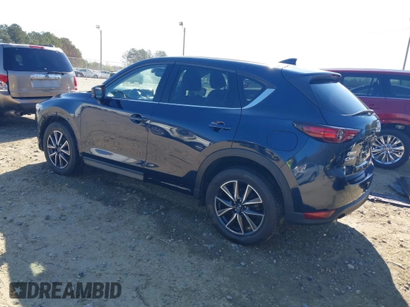 2018 Mazda CX-5 Grand Touring with VIN JM3KFADM1J0322049, listed as a IAAI auction lot 41891079 with 174,939 mi miles and . Bid and sale history available at DreamBid. Image 3.