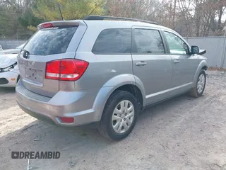 2019 Dodge Journey SE with VIN 3C4PDCBB0KT719211, listed as a IAAI auction lot 41823499 with 151,569 mi miles and . Bid and sale history available at DreamBid. Image 4.