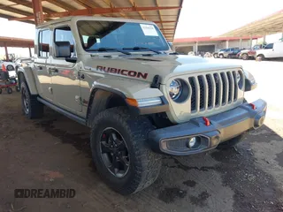 2022 Jeep Gladiator Rubicon with VIN 1C6JJTBG2NL164117, listed as a IAAI auction lot 42450350 with 22,326 mi miles and . Bid and sale history available at DreamBid. Image 1.