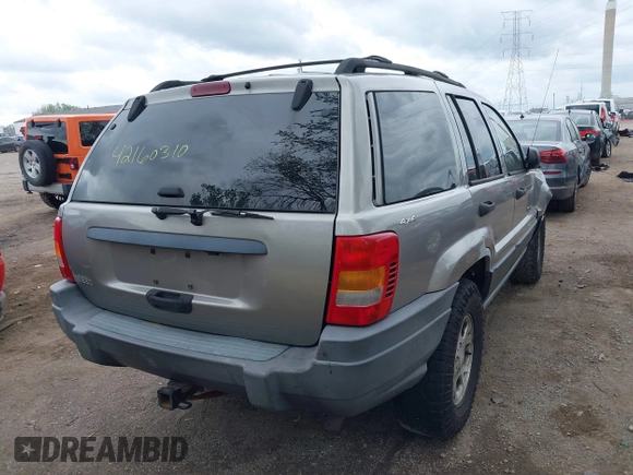 2001 Jeep Grand Cherokee Laredo z VIN 1J4GW48S01C658017, wystawiony jako IAAI lot #42160310 z przebiegiem 220 309 mil mil oraz . Historia ofert i sprzedaży dostępna na DreamBid. Obrazek 4.