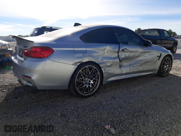 2015 BMW M4 with VIN WBS3R9C58FK334216, listed as a Copart auction lot 61497804 with 112,191 mi miles and Salvage Title. Bid and sale history available at carsss.com. Image 3.